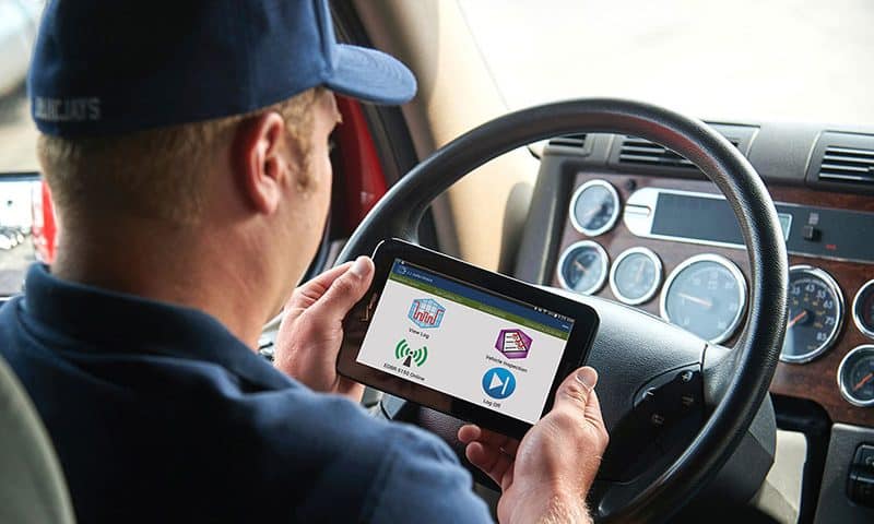 Truck driver looking at electronic log