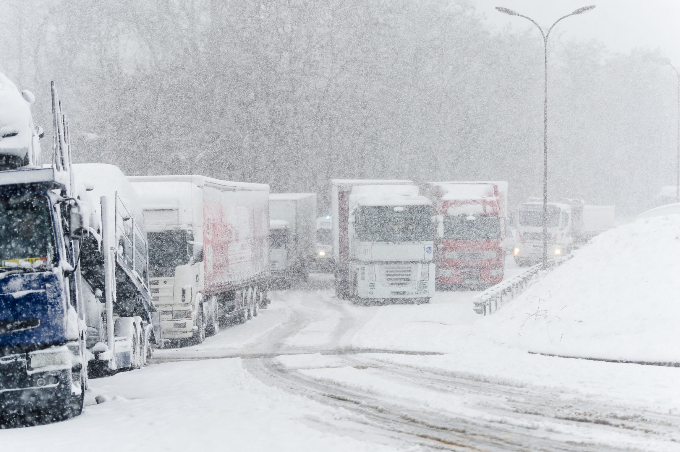 Trucks on highway during storm