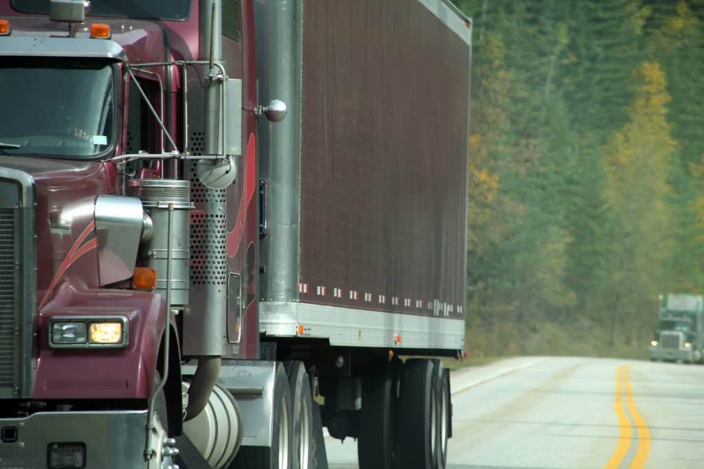 purple truck on highway