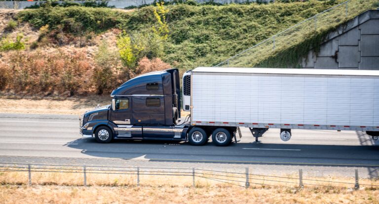 Truck on highway with trees