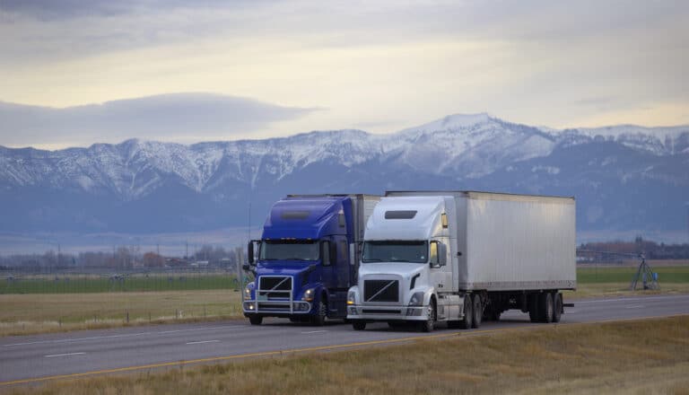 two trucks on road