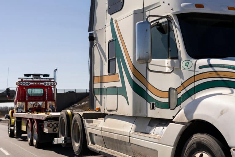 tow truck and broken truck