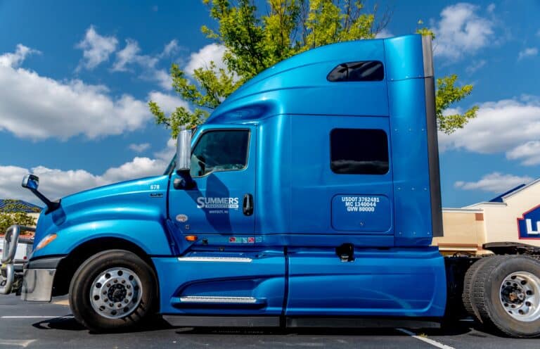 Horizontal, medium shot of a blue tractor