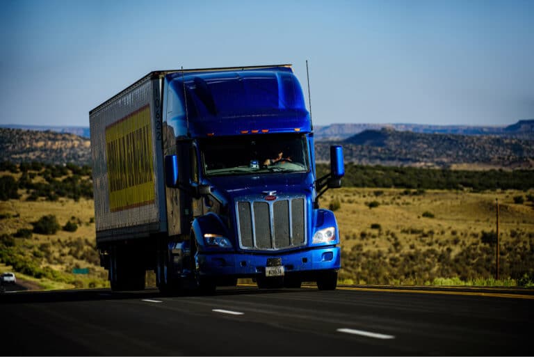 bñlue truck on desert highway