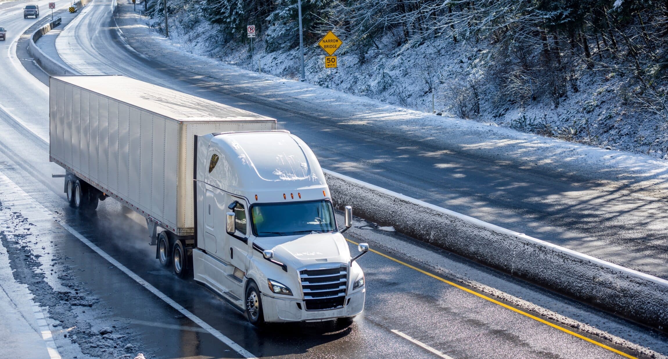 white semi truck on a winter road