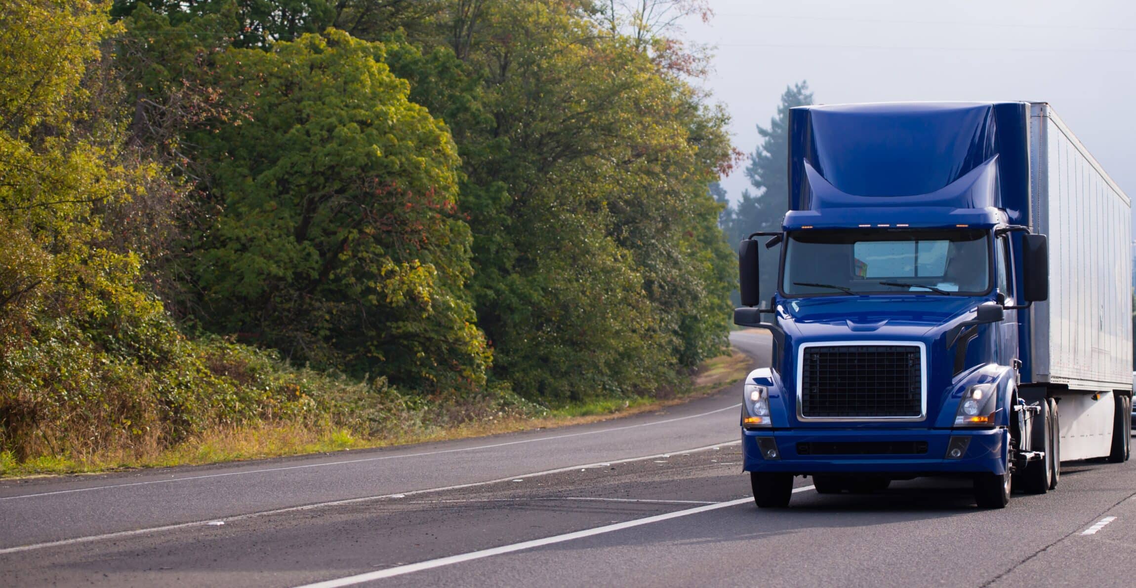 Dark blue day cab big rig semi truck