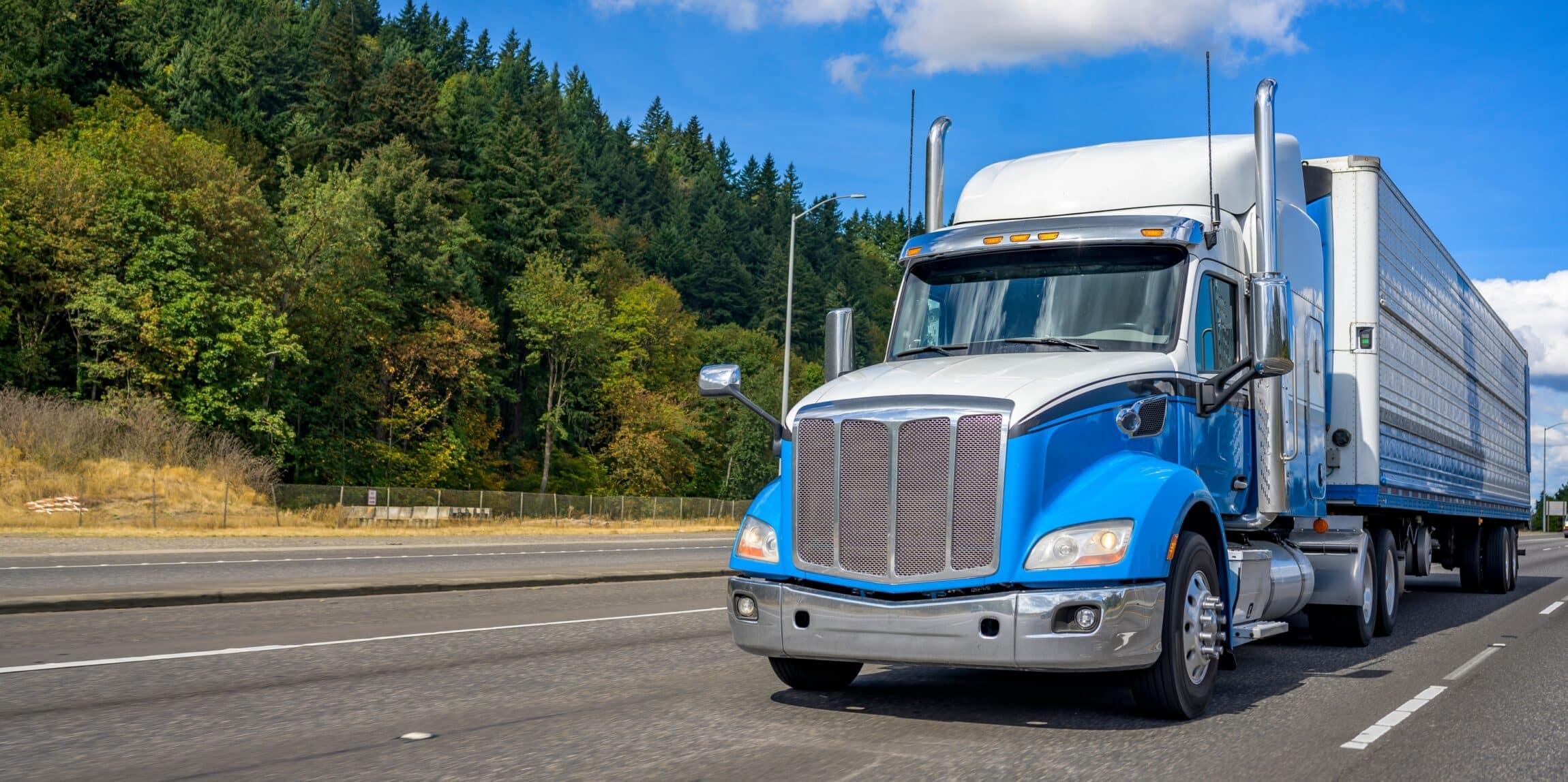 blue and white industrial big rig