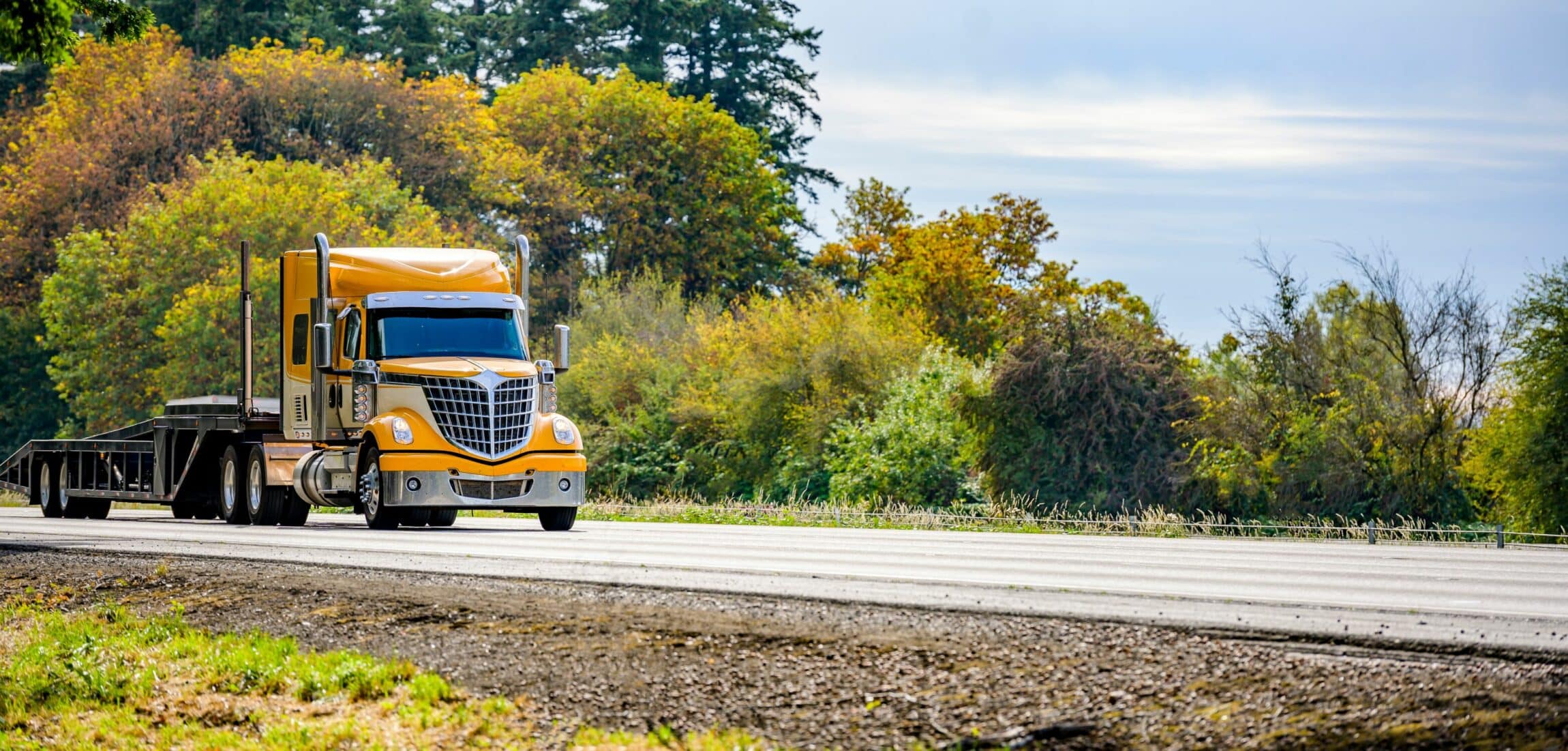 yellow long hauler big rig