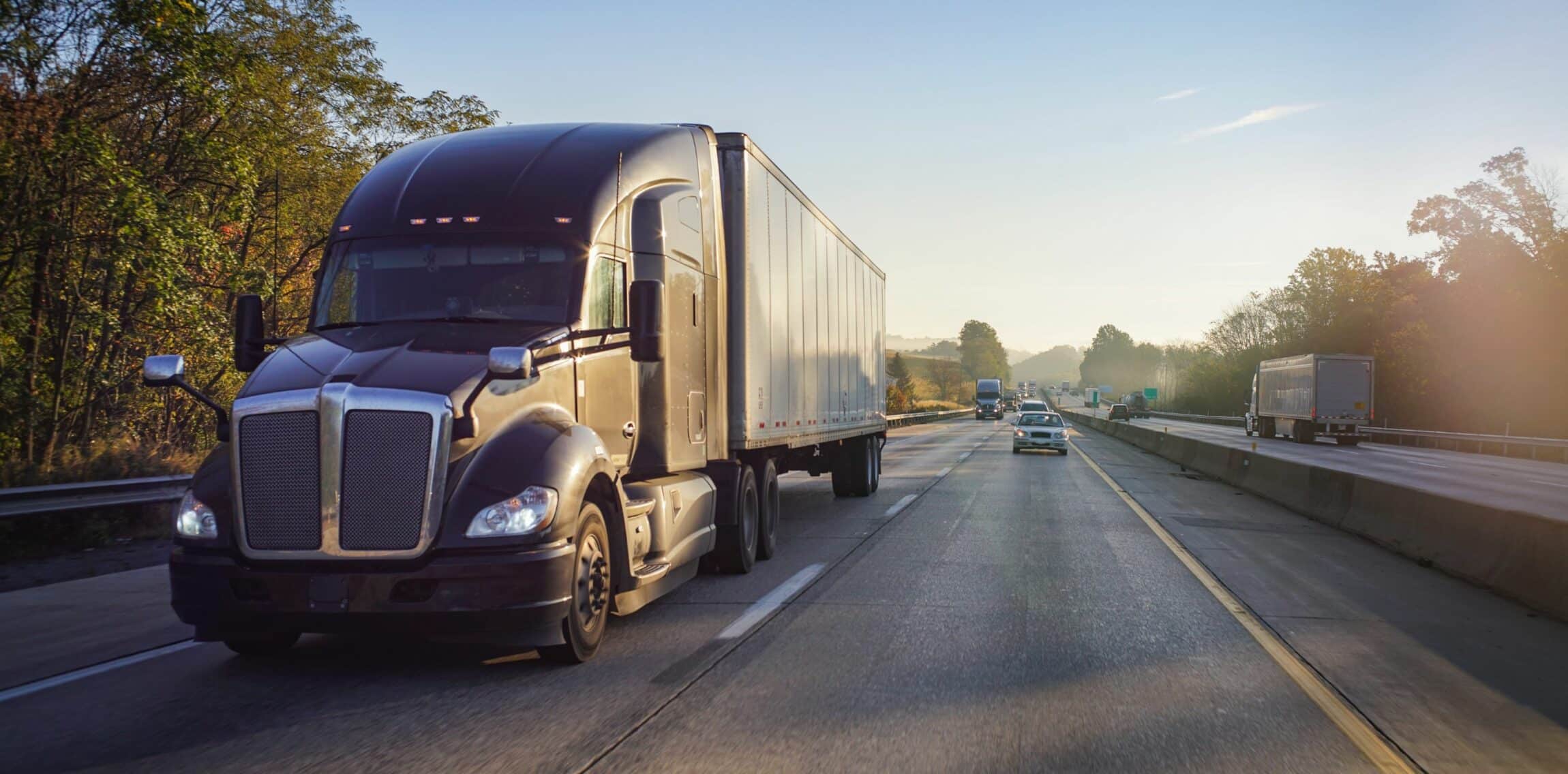 Truck on road at sunrise