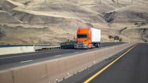 orange truck on highway