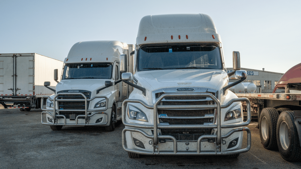 Front of two white semis