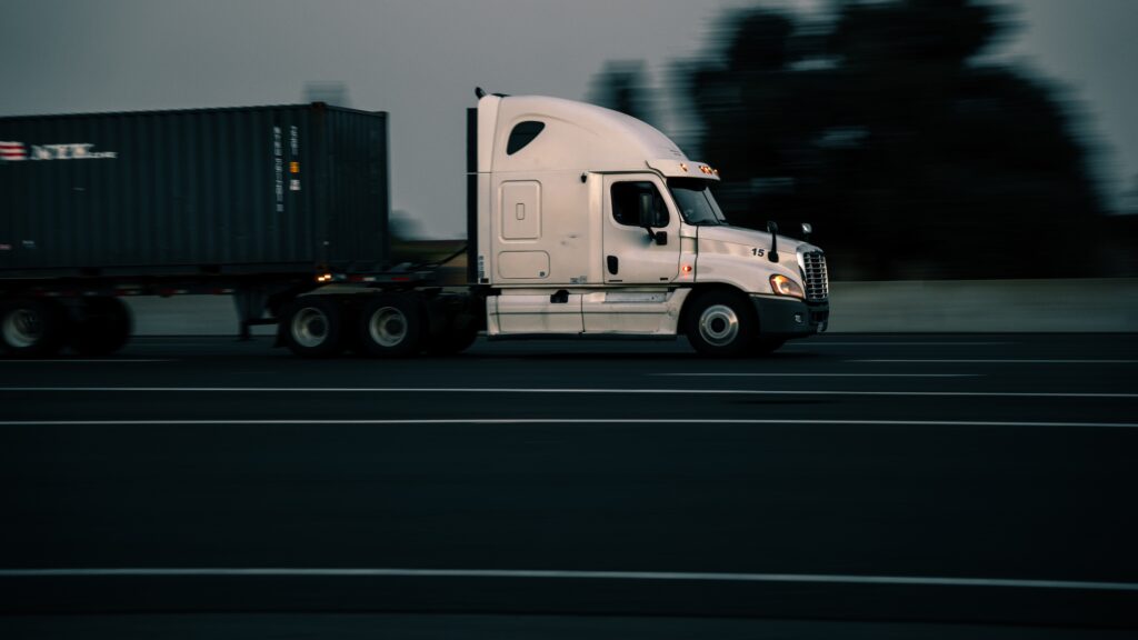 White rig driving on highway