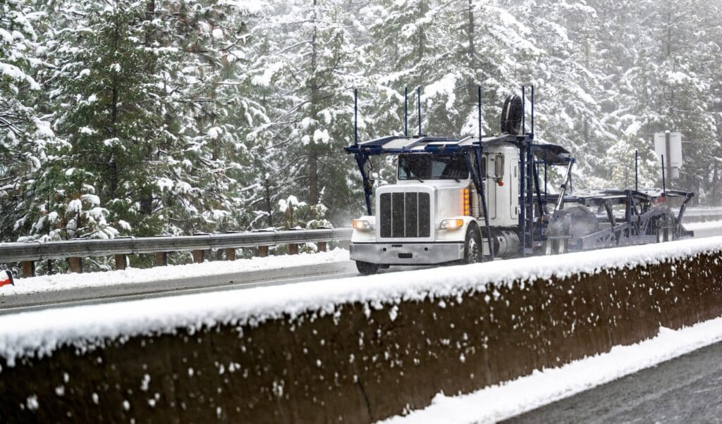 white big rig on a snow road