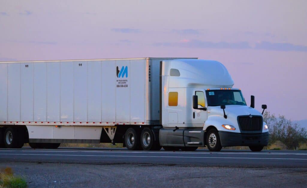 white semi truck in the dusk