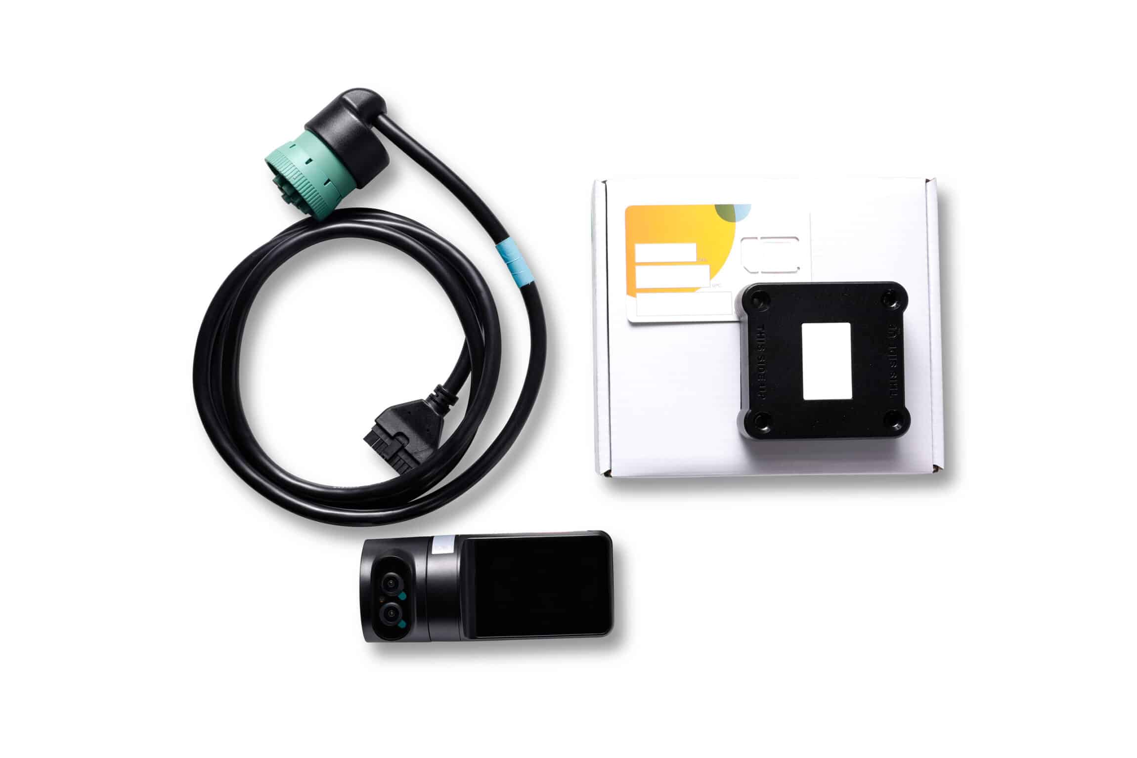 A truck dash cam kit, including a camera, a connecting cable, a mounting bracket, and a box with installation materials