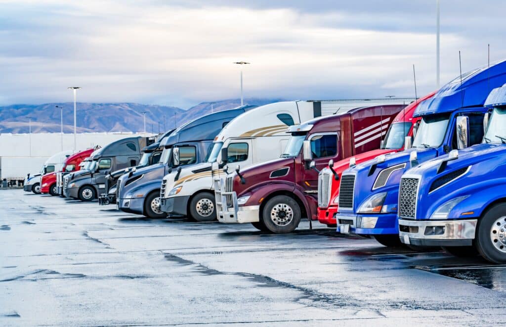 semi trucks standing in row