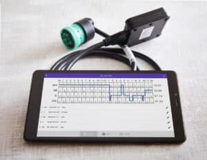 HOS247 ELD system with tablet displaying driver logs