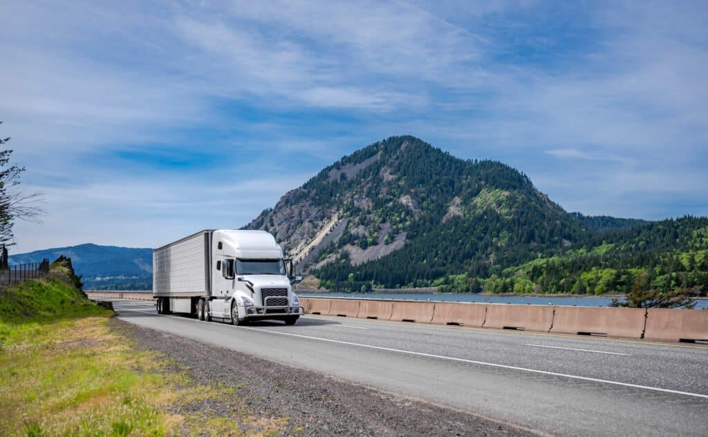 Industrial long hauler big rig white semi truck tractor carrier