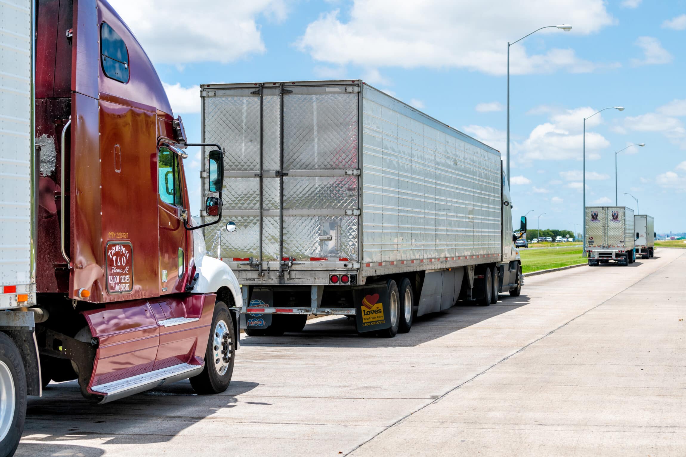 Truck stop on highway with many vehicles parked