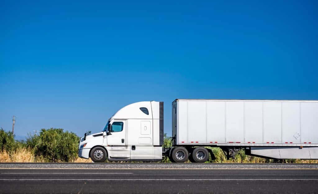 white big rig on the road