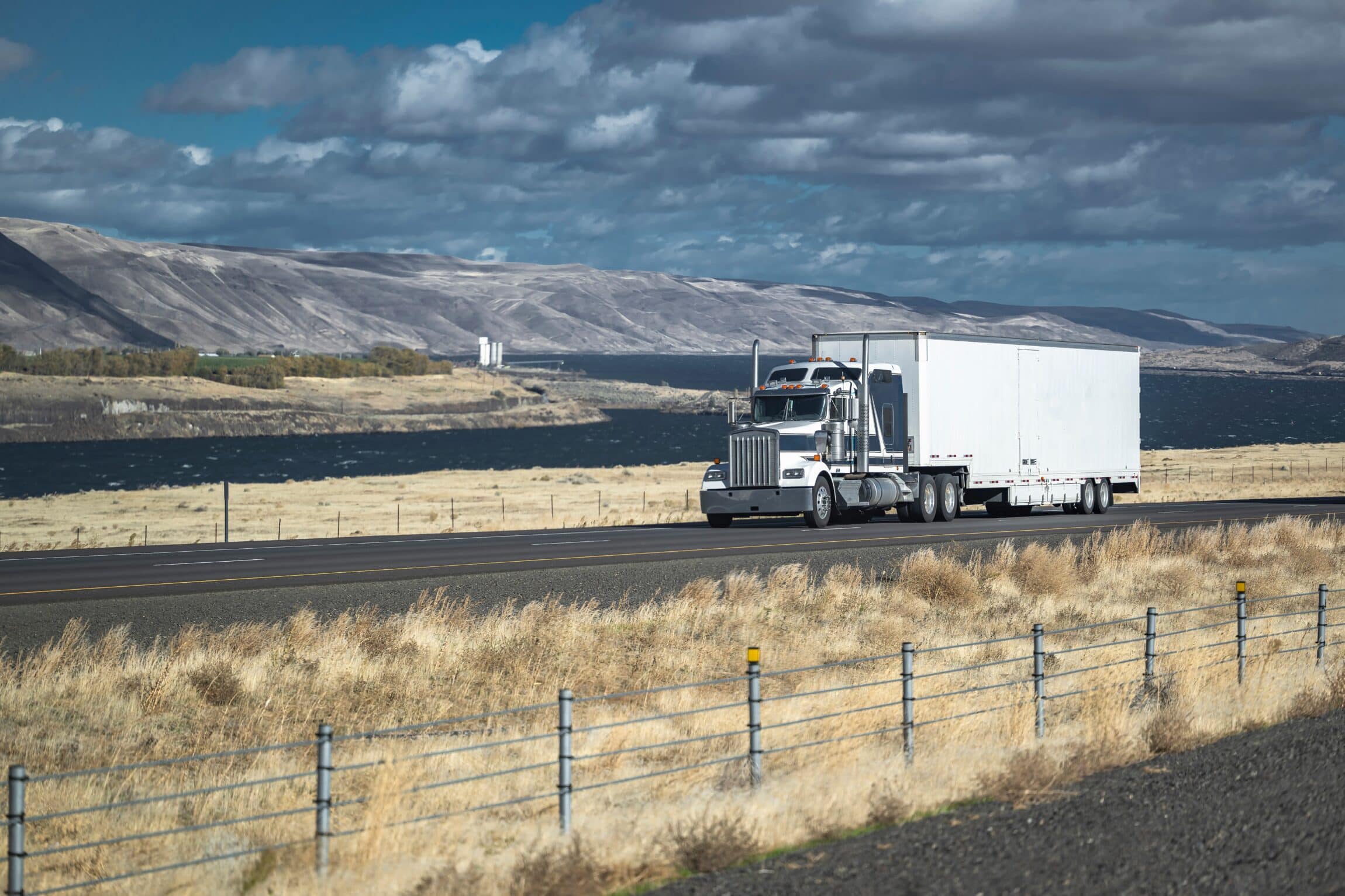 big rig gray semi truck tractor with chrome grille