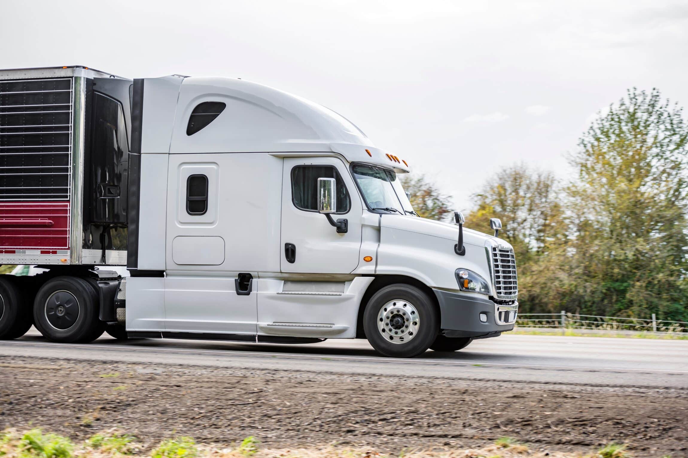 Side of bonnet powerful long haul white big rig