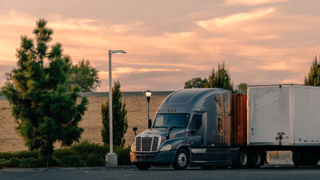 Big rig at dusk on the side of the road
