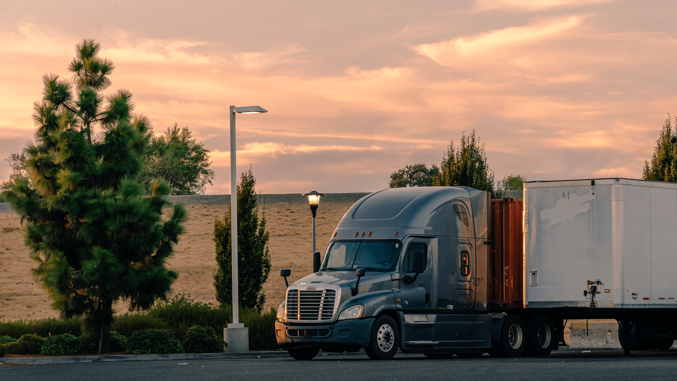 Big rig at dusk on the side of the road