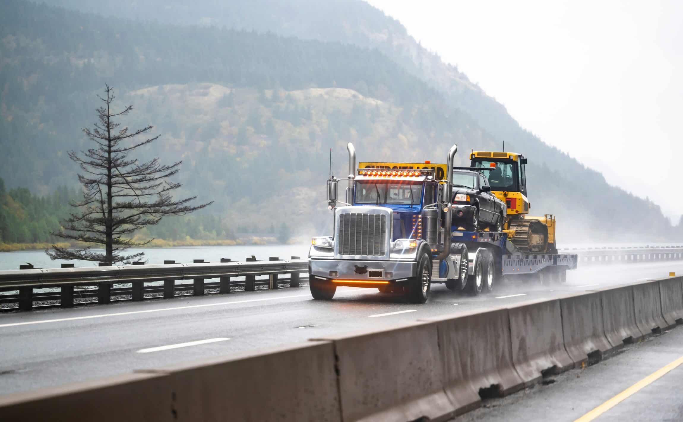 powerful big rig classic semi truck tractor with oversize load