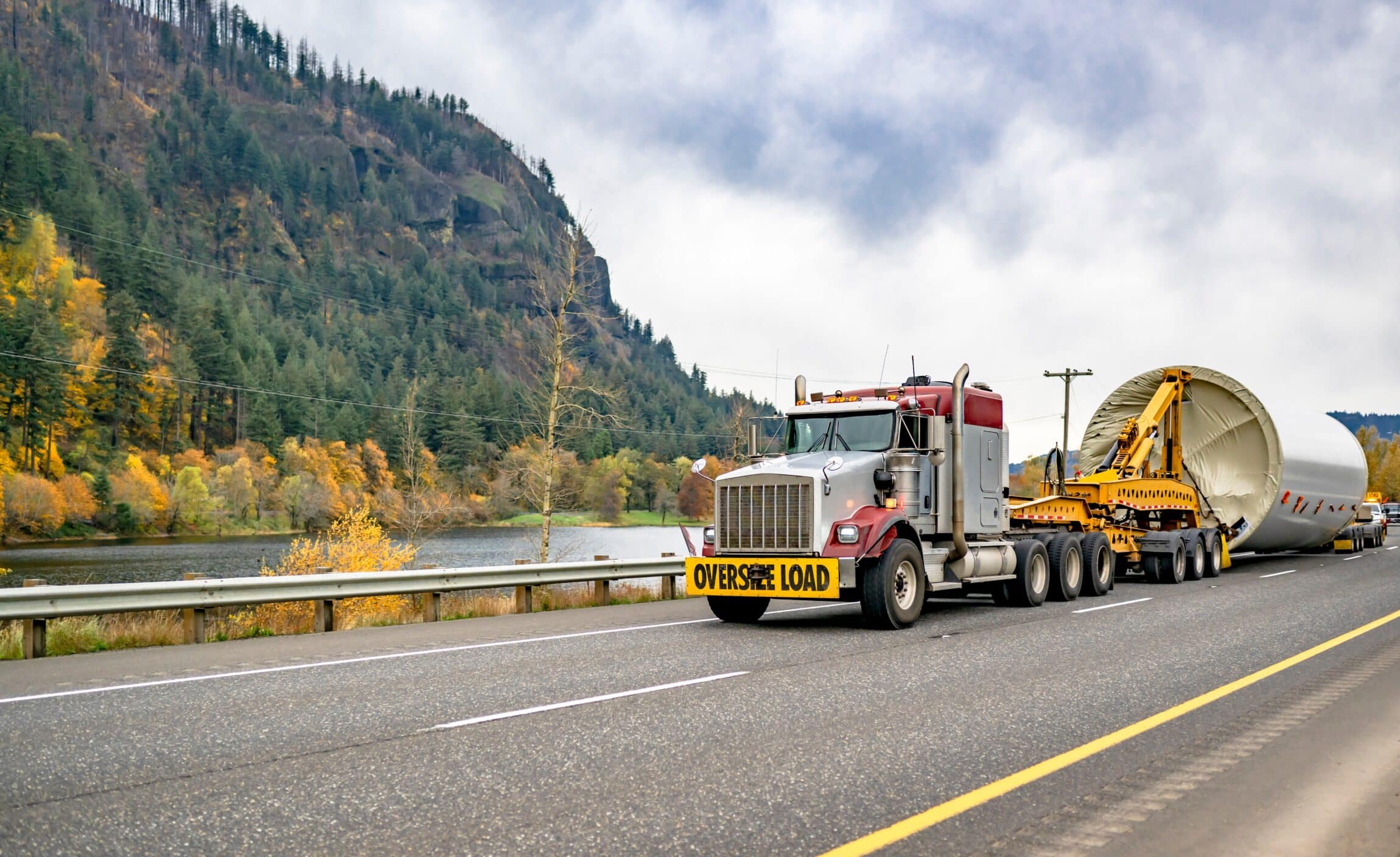 Industrial carrier big rig semi truck with oversize load