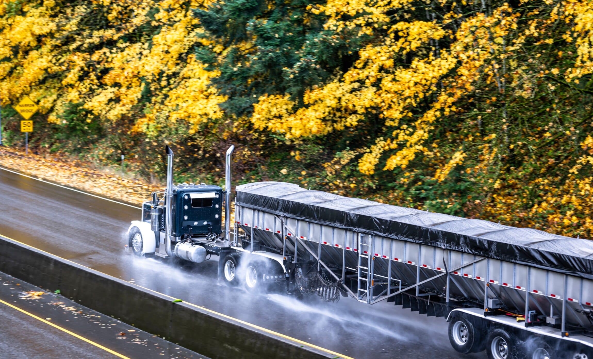big rig semi truck tractor with day cab transporting cargo