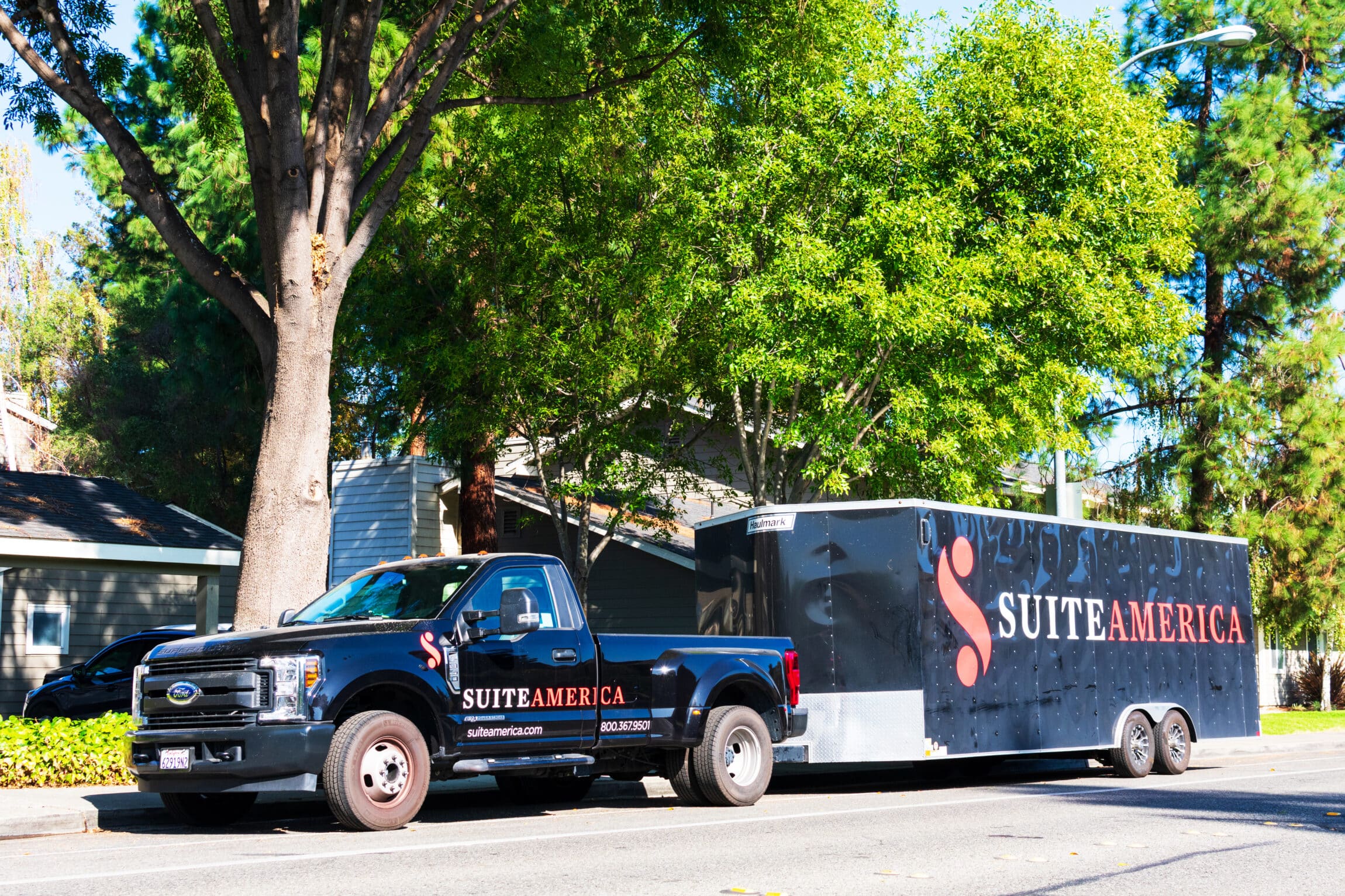 black pickup truck with a trailer