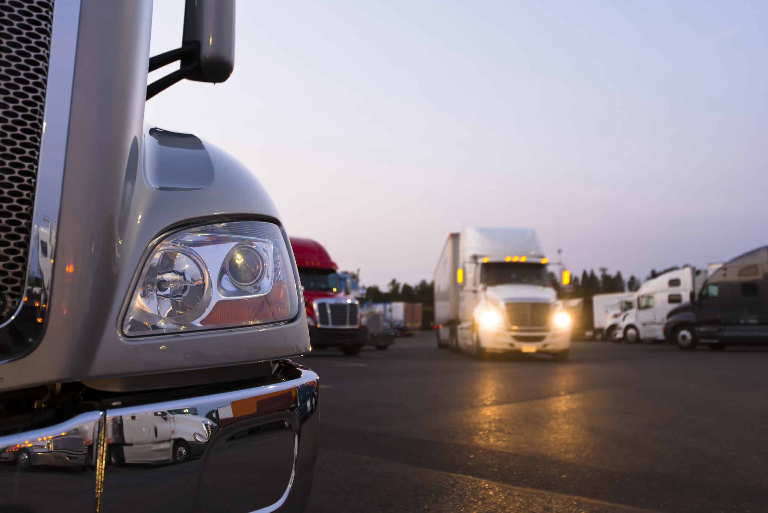 Fontal shot of truck in parking lot with other trucks