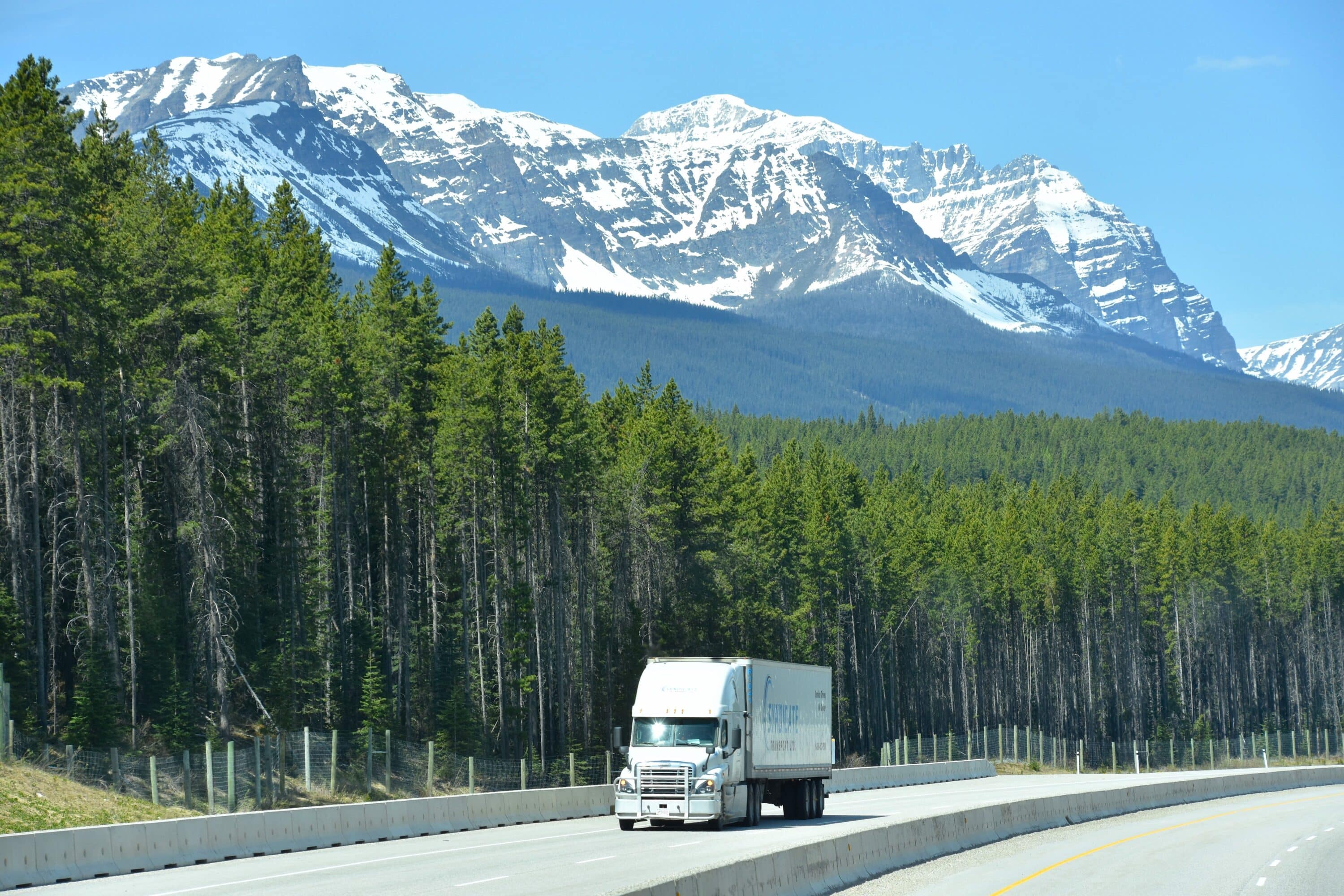 Truck on the highway with mountains