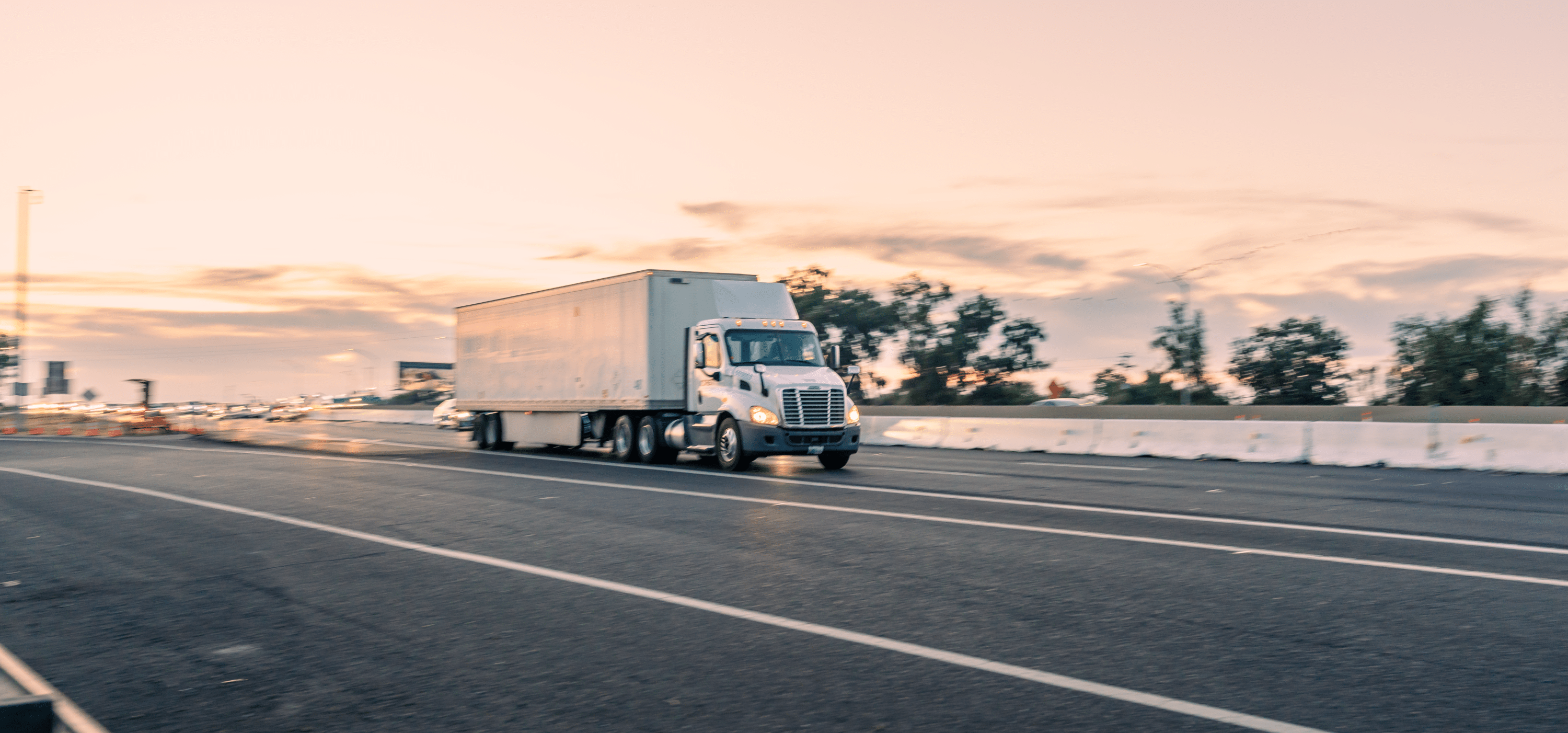 white semi truck on the highway
