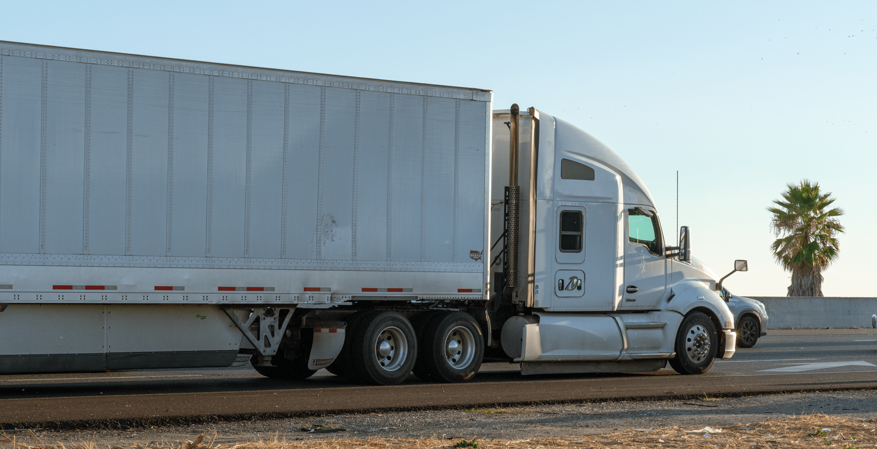 white big rig on the road