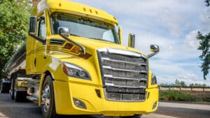 Bright yellow cab of a semi truck