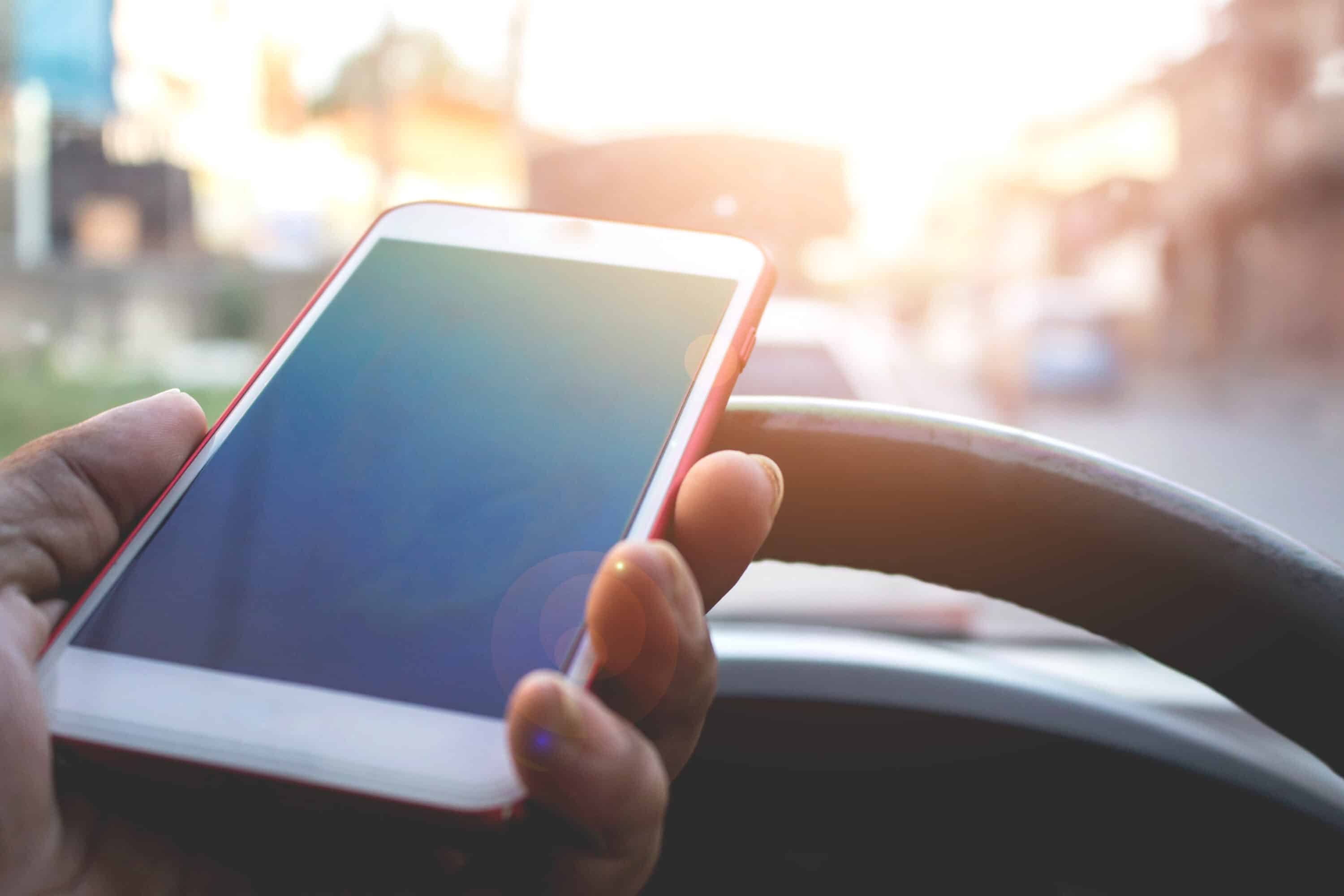 trucker holding a mobile phone
