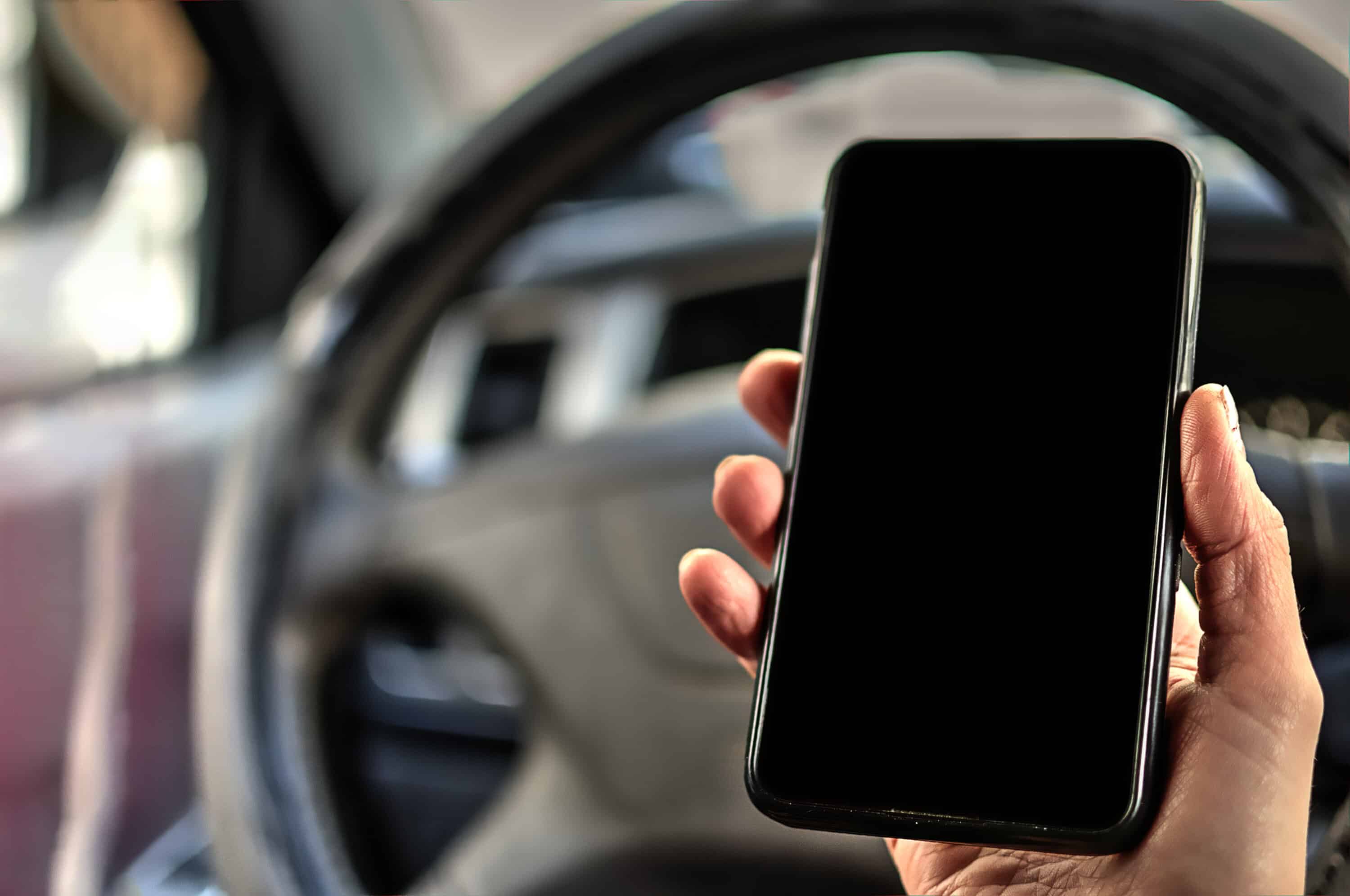 trucker holding a mobile phoe