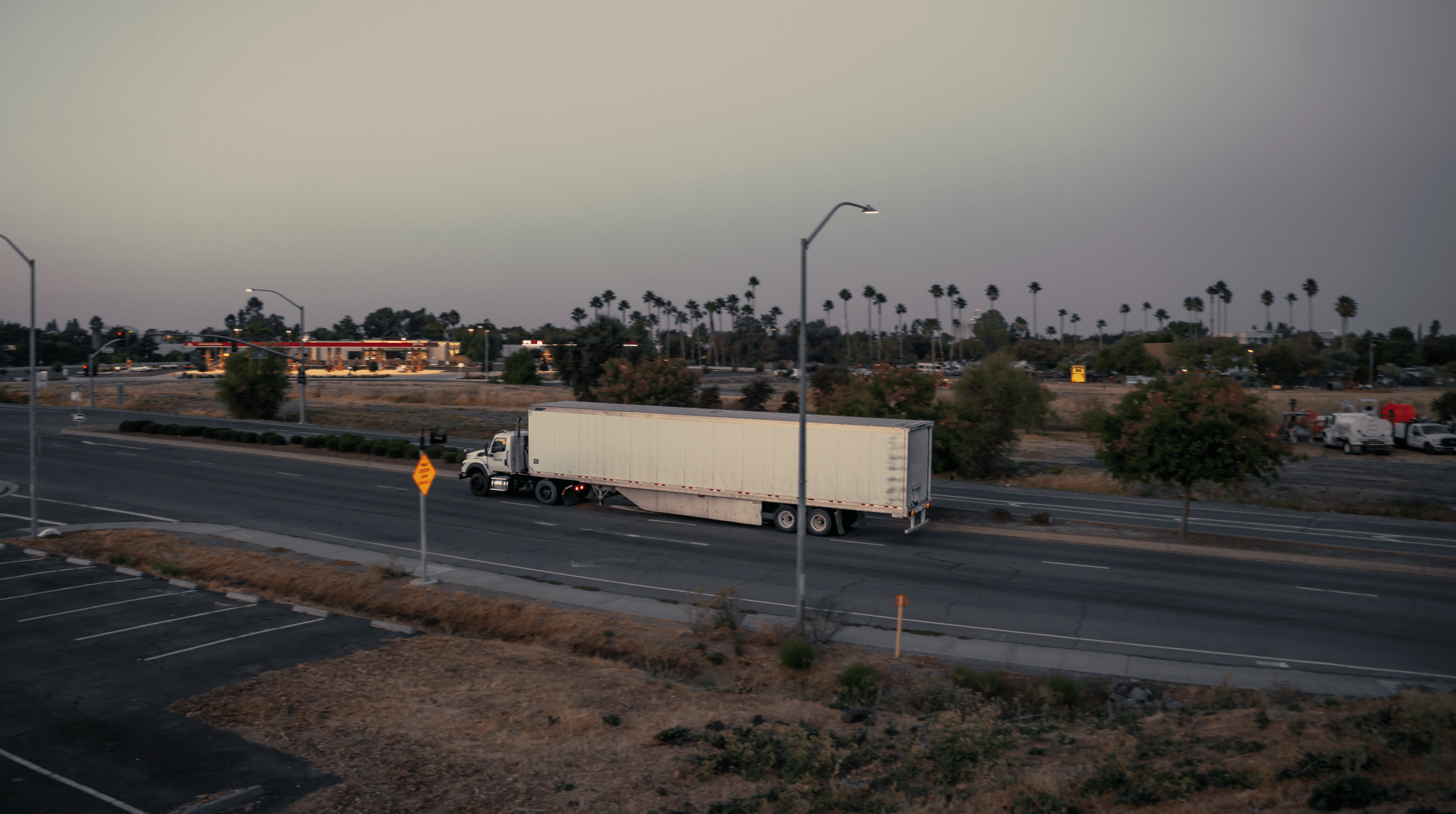 white semi truck on the highway