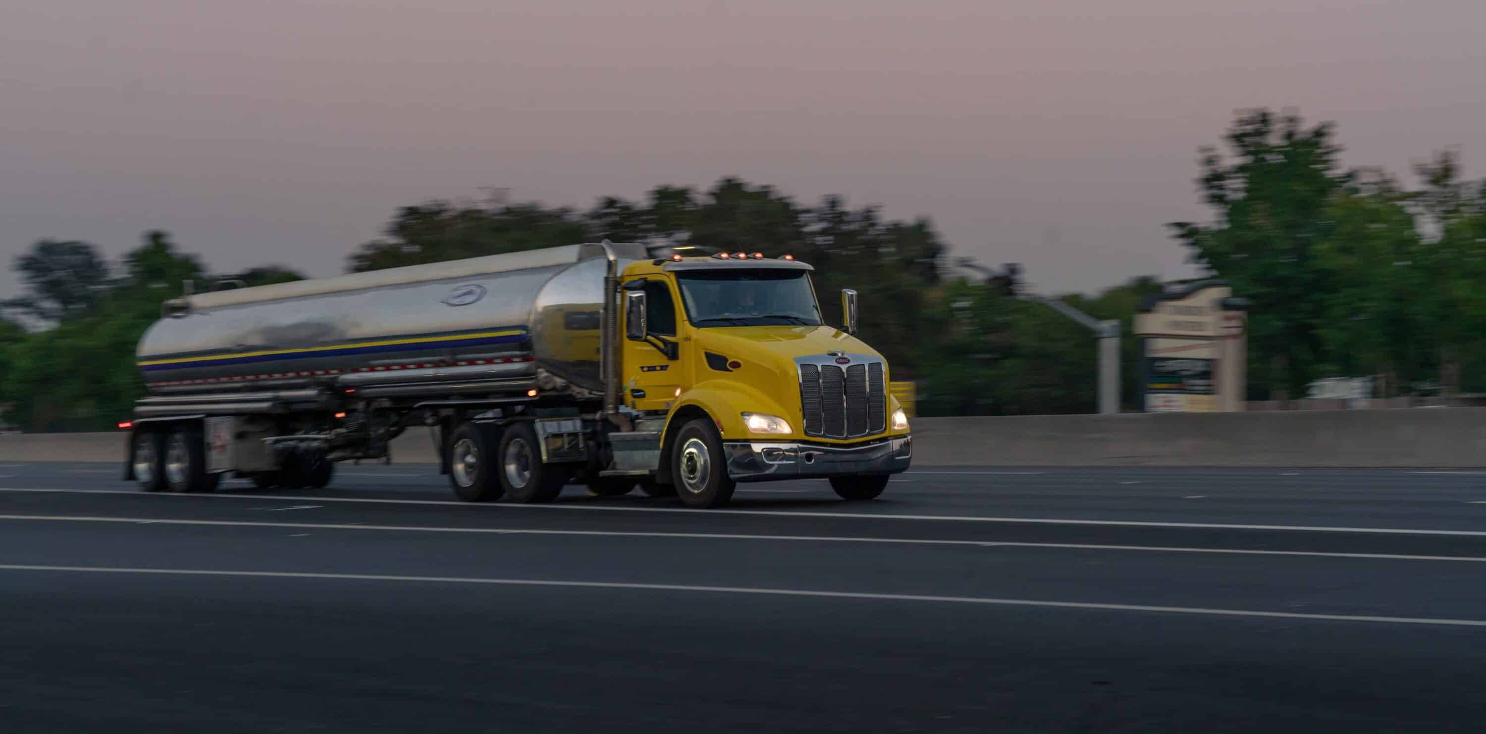 Yellow semi truck on the road