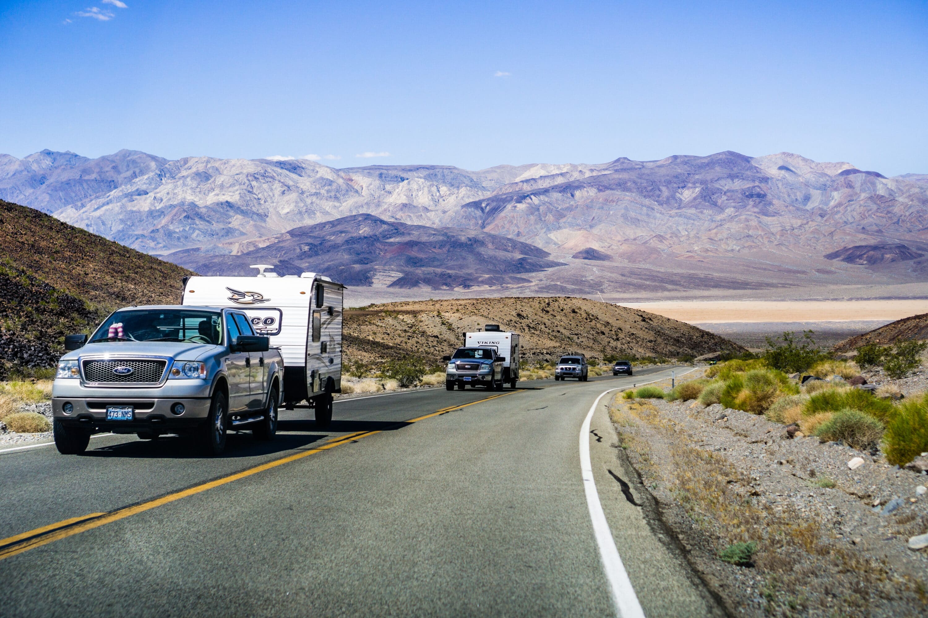 pickups with trailers driving on the road